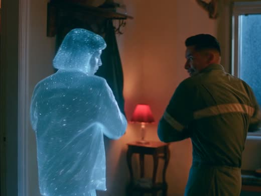 A man in his own home dances with the glittering figure, mirroring it. A scene that was cut
